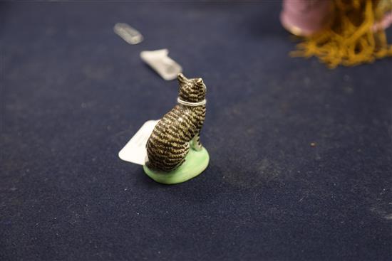 A rare Lowestoft porcelain figure of a seated tabby cat, c.1780, H. 5.9cm, one ear restored, shallow chip to base